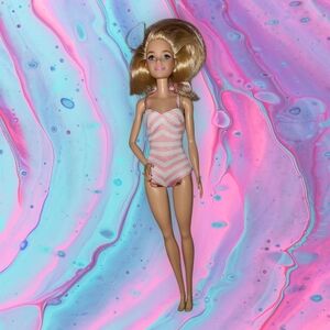 Barbie doll in pink and white swimsuit (as is)